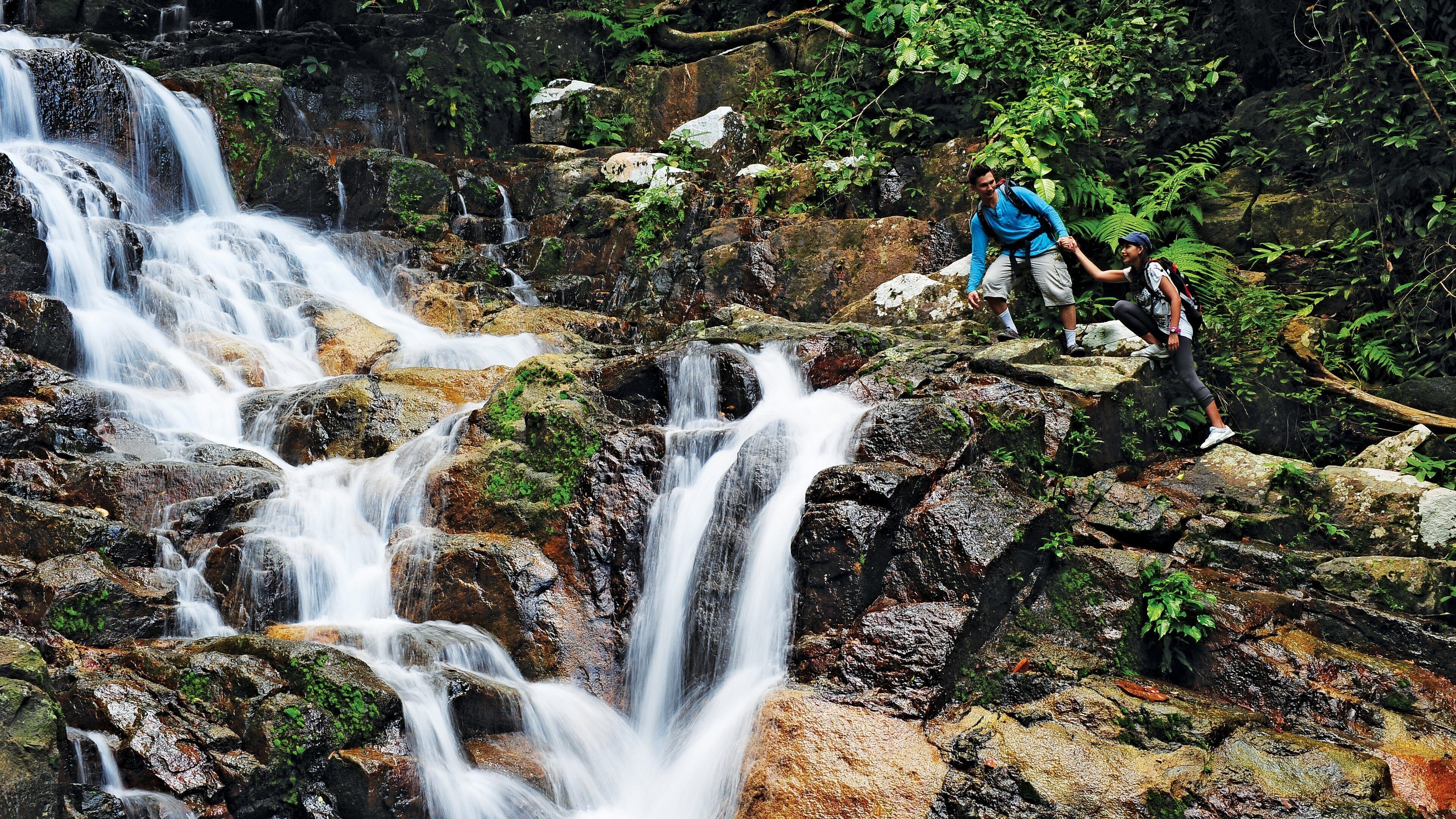 Johor Bahru which includes a river or creek, hiking or walking and a waterfall