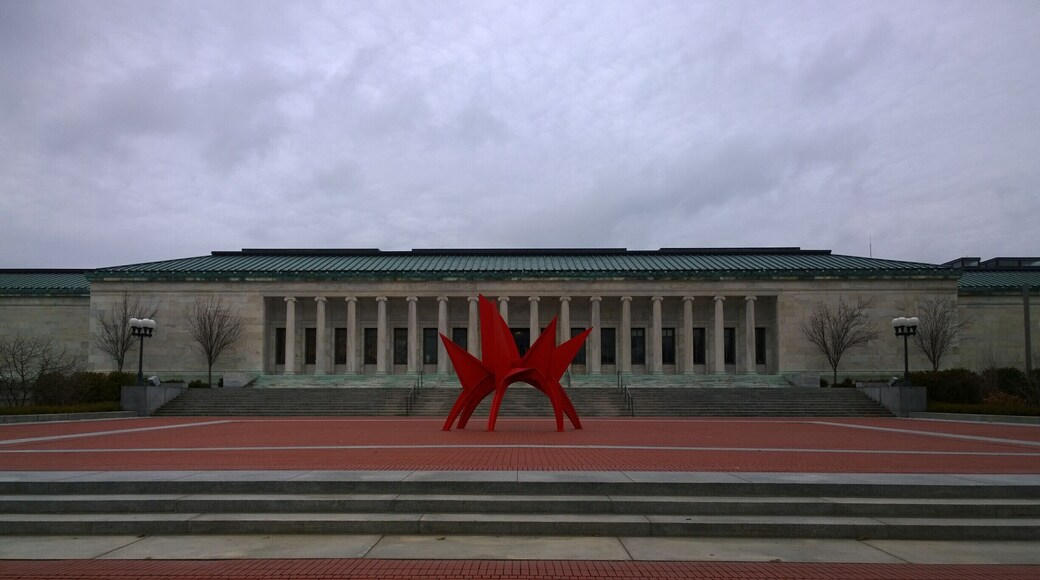Opened in 1912, the Toledo Museum of Art’s Greek Ionic façade has graced the city as both landmark and legacy. The distinguished low and horizontal white marble building is articulated by a row of 16 columns, a copper roof, and a frieze of acanthus leaves. It has been renovated and expanded four times since then.