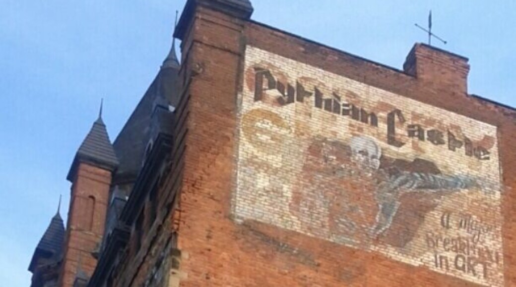 A mural painted on the side of the Pythian Castle that reads "A major breakthrough in art." The building was built in 1890 and has been vacant since the 1970's.