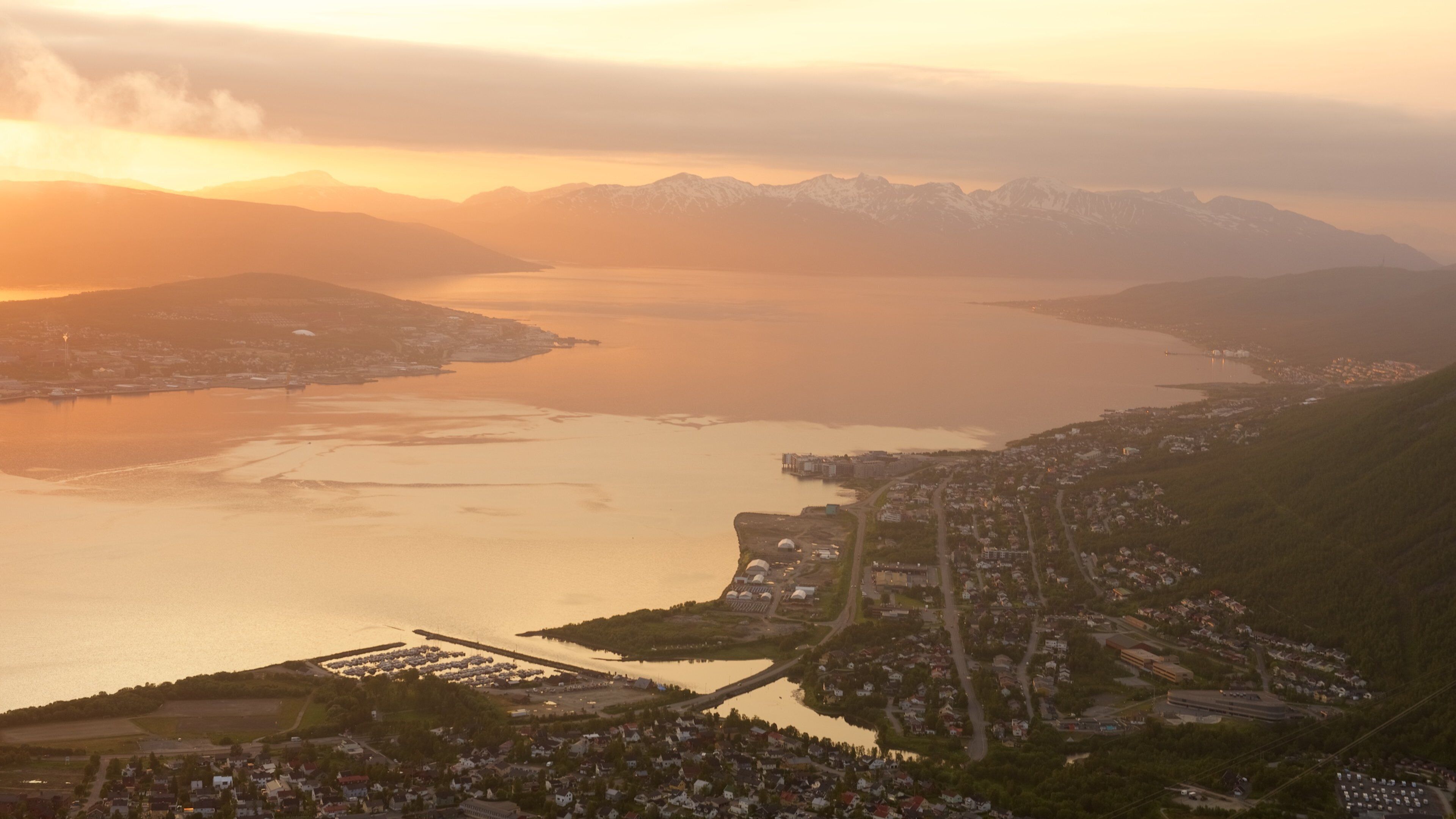 Tromso showing a sunset, mountains and a lake or waterhole
