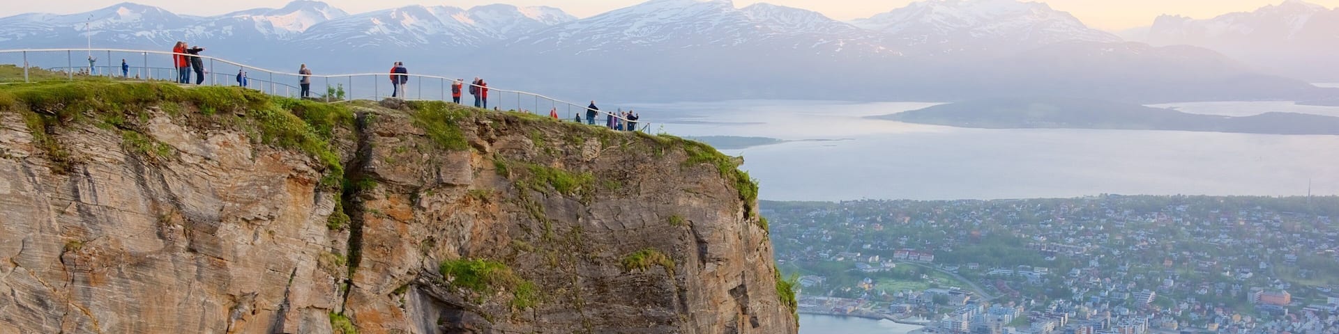 Tromso featuring a small town or village, a lake or waterhole and mountains