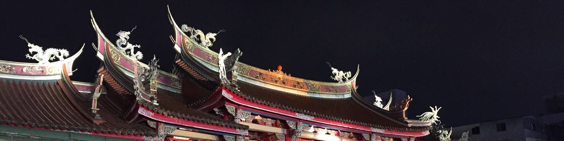 Last night we went to a Taoist Temple in Taipei. You can see in the close up picture of people praying how they receive and answer immediately from the prayers. After kneeling and bowing, you throw two "stones" onto the floor. They are both crescent shaped with a sun and a moon side. If they end up both on one side, the answer is NO. If they end up both on the other side, the answer is maybe, or not enough information. If the end up like a ying and a yang, then the answer is YES. I took a moment to pray, asked my question and got a ying and a yang out of the throw. The belief is, that the result comes from within your own heart.