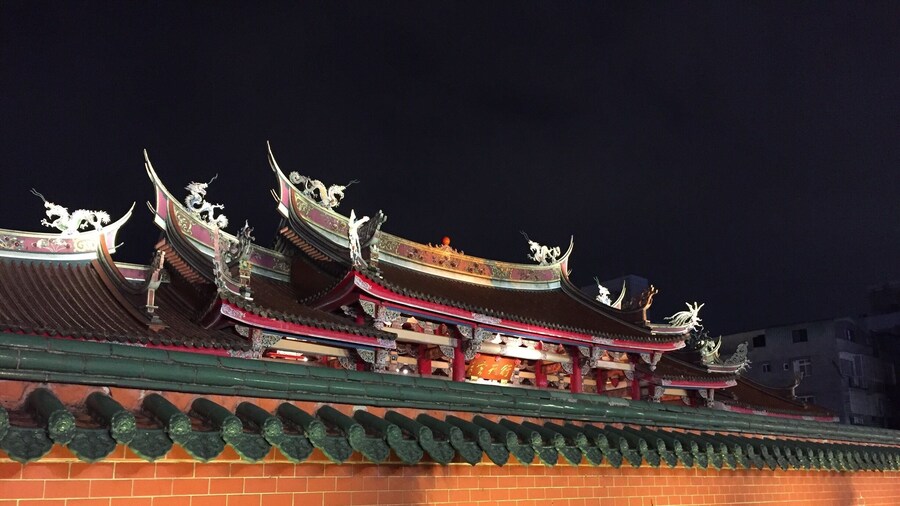 Last night we went to a Taoist Temple in Taipei. You can see in the close up picture of people praying how they receive and answer immediately from the prayers. After kneeling and bowing, you throw two "stones" onto the floor. They are both crescent shaped with a sun and a moon side. If they end up both on one side, the answer is NO. If they end up both on the other side, the answer is maybe, or not enough information. If the end up like a ying and a yang, then the answer is YES. I took a moment to pray, asked my question and got a ying and a yang out of the throw. The belief is, that the result comes from within your own heart.