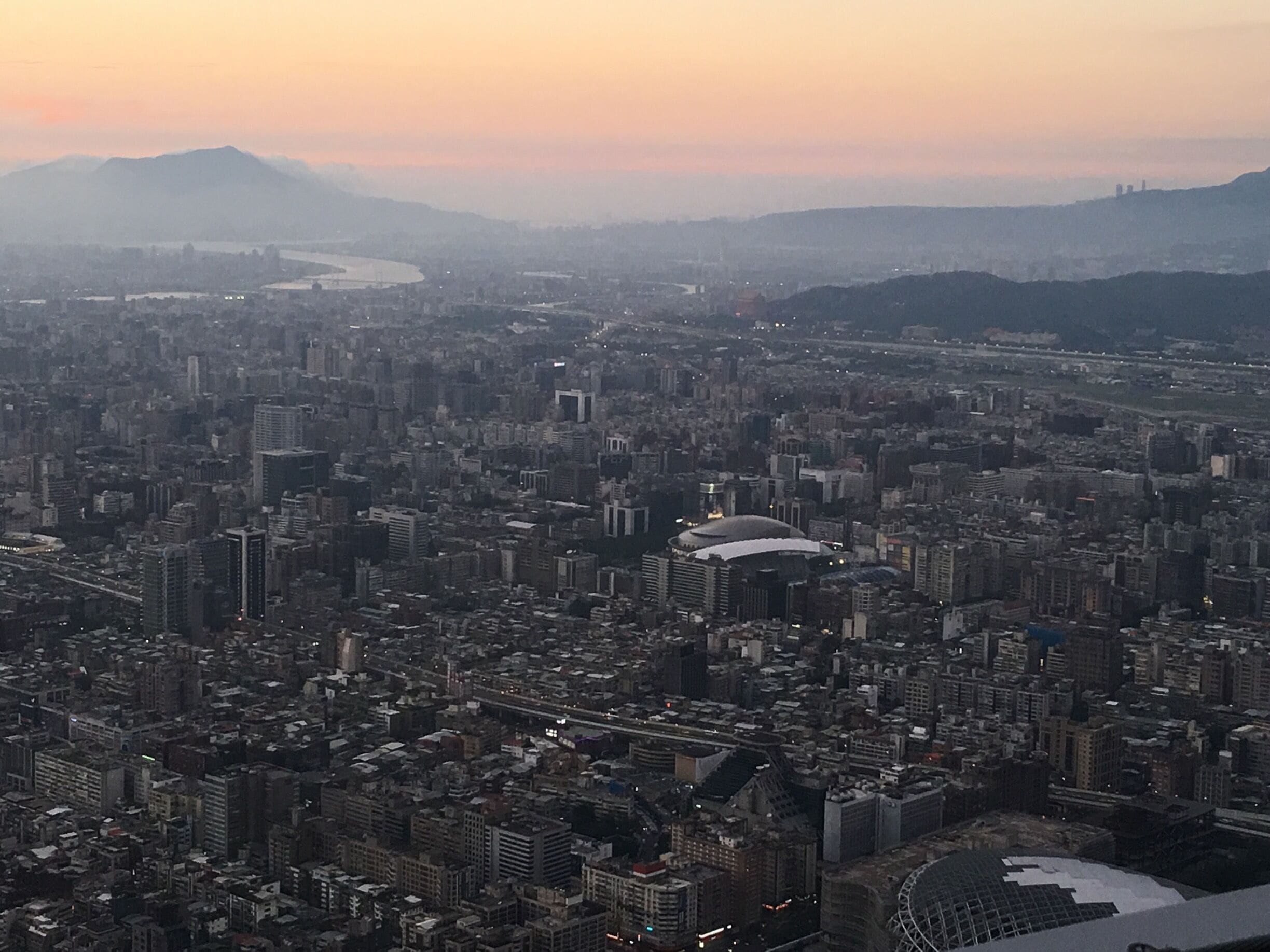 Sunset view of a city grown beyond recognition. Huge and quite exciting from the top!