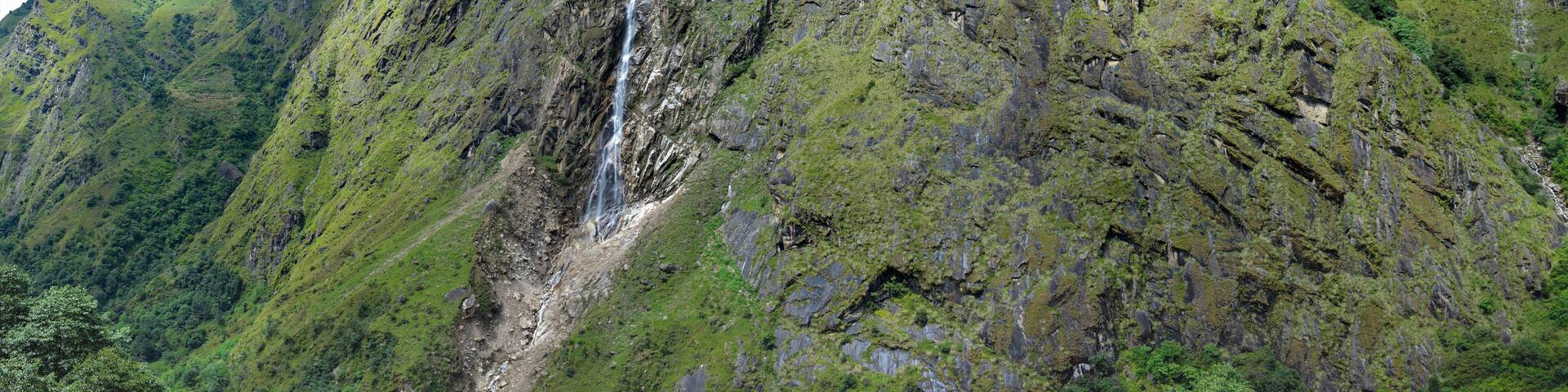 View of the Himalayan Mountains and beautiful cascade on the way to Kangchenjunga base camp, Nepal