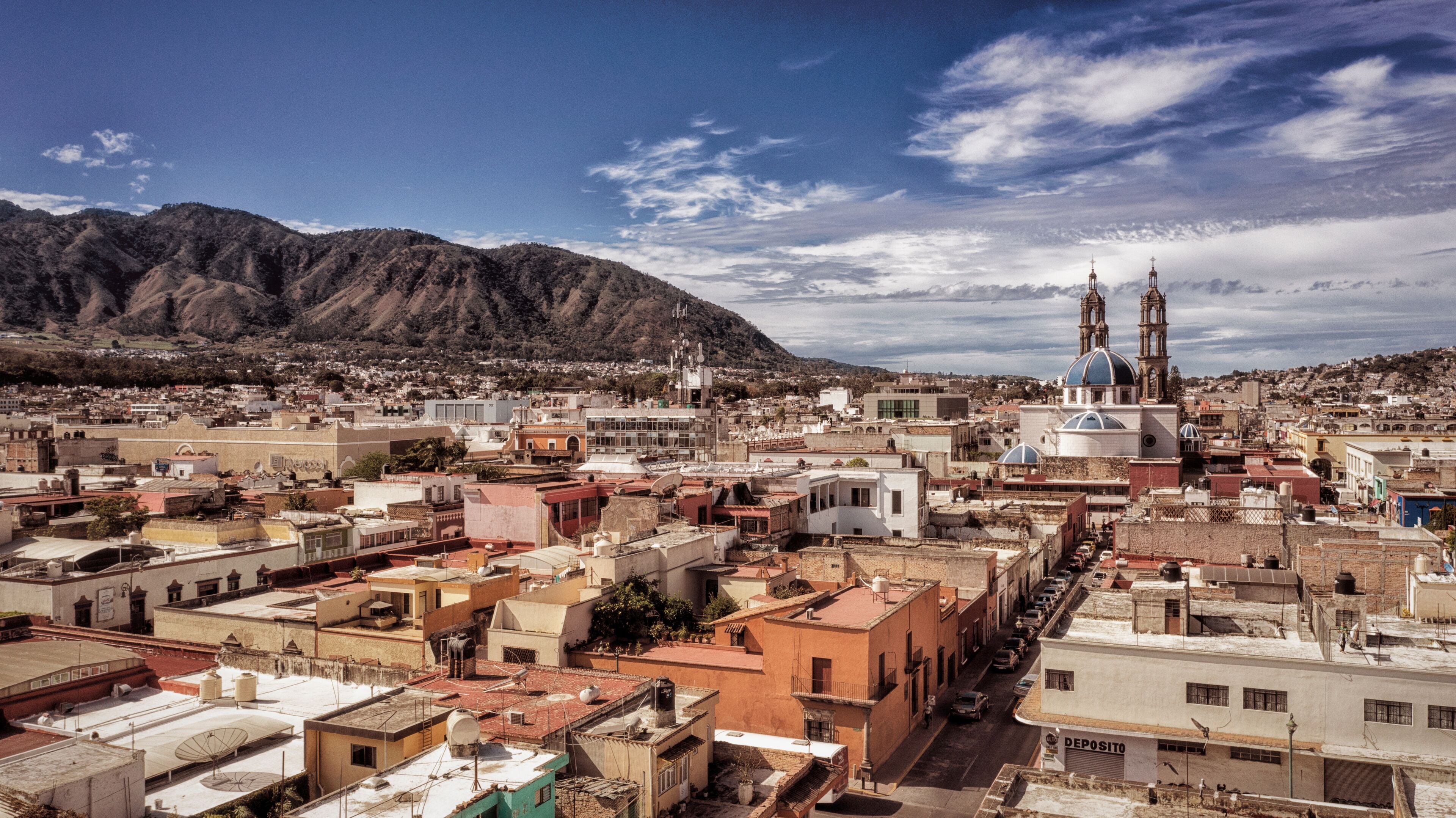 Tepic city in Nayarit Mexico. Panoramia Aerial drone view of town Tepic and San Juan mountain.	