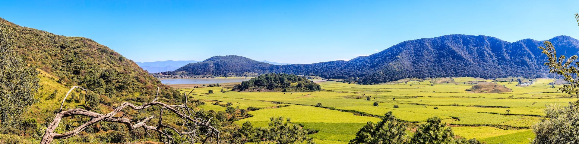 panoramic of the Tepetiltic volcano crater in Nayarit, mountains and green fields with mountains in the background