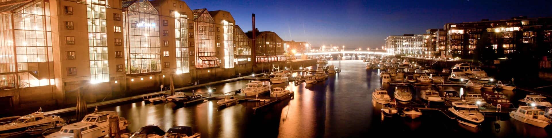 Trondheim showing night scenes, a coastal town and a bay or harbour