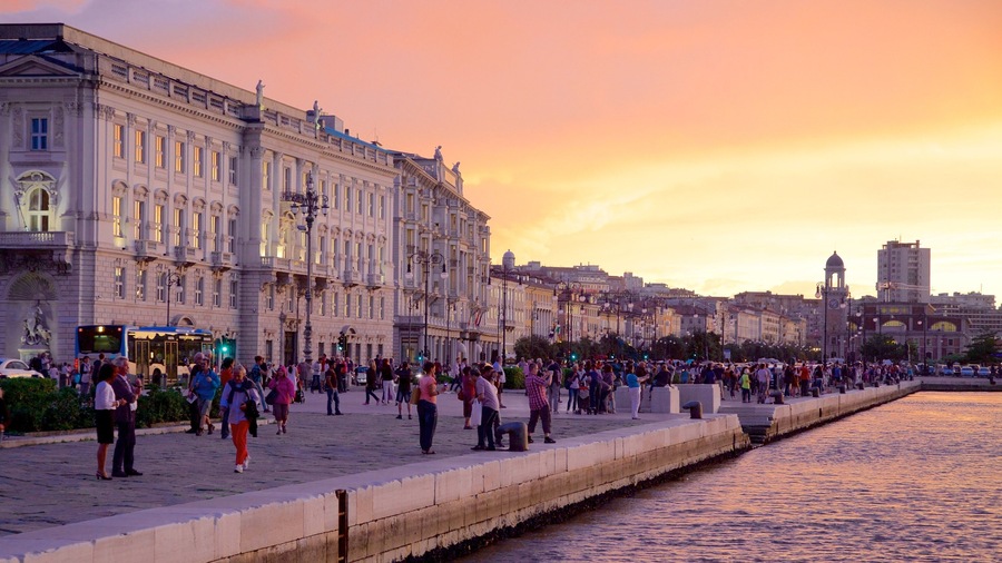 Trieste which includes a sunset, a river or creek and heritage architecture