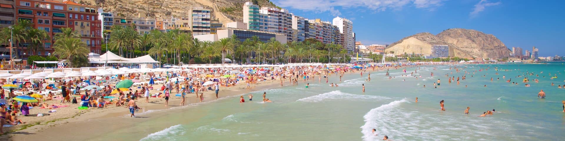 Alicante showing swimming, a sandy beach and a coastal town