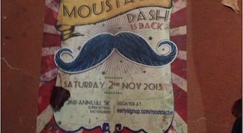 Sidewalk ad promoting the Amazing Moustache Dash...whatever that is!