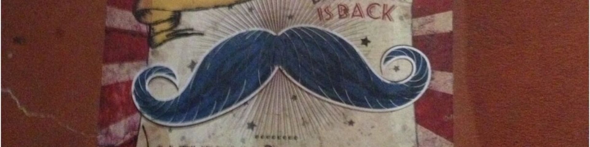 Sidewalk ad promoting the Amazing Moustache Dash...whatever that is!