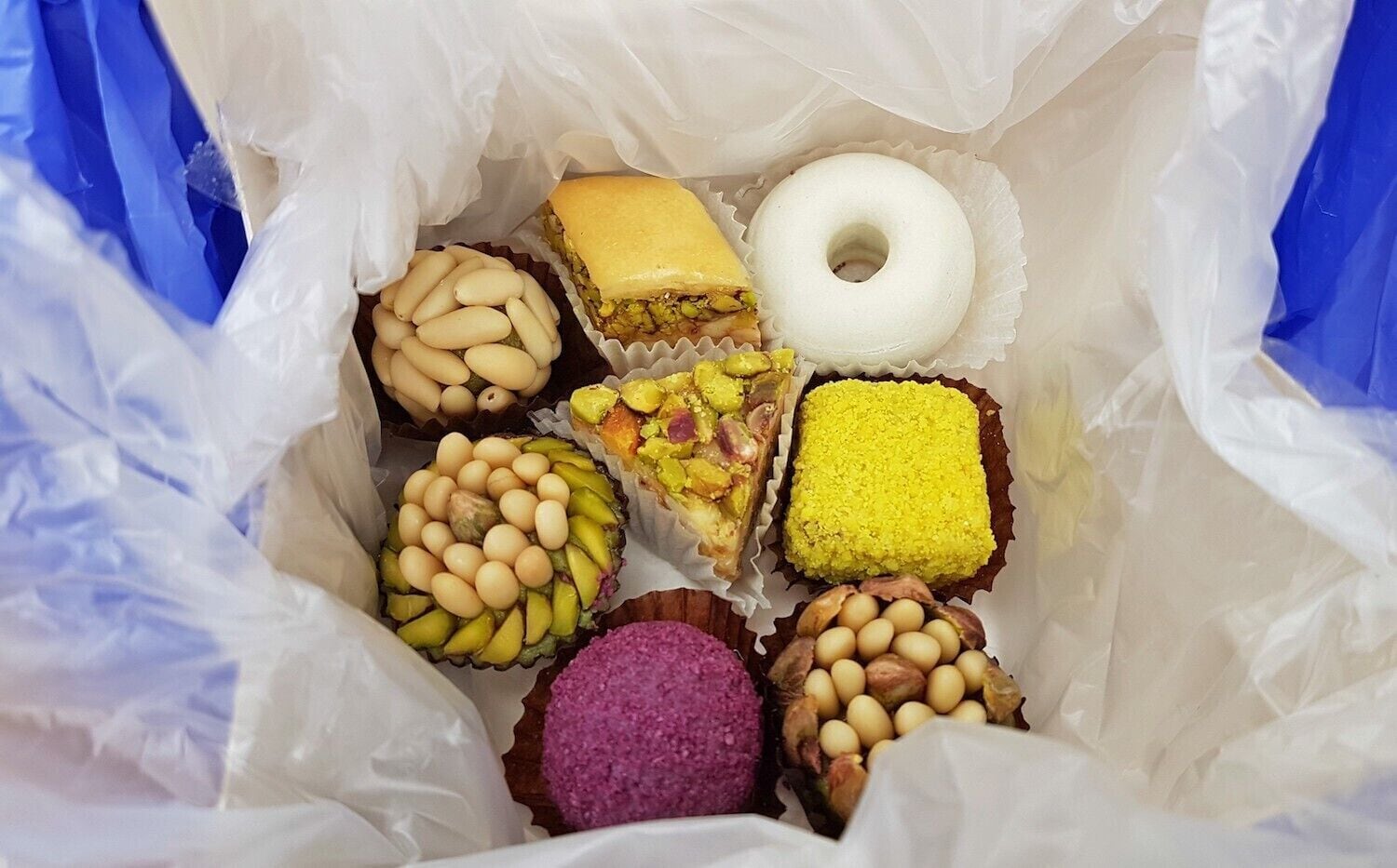 Random sweet shop we happened to pop into, with some interesting looking sweets for sale. We asked for a mix and ended up with these, all of which were excellent.

#sweets #dessert #tunis