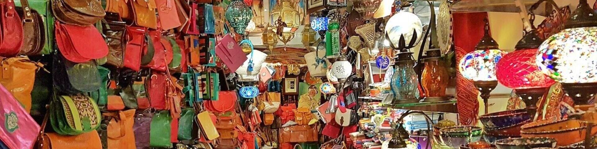 A vibrant market with colorful bags and decorative items.