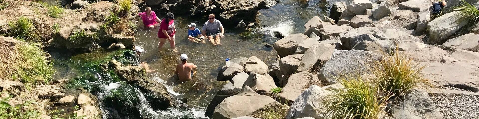 People gather at a hot spot in the Waikato river. Because of the geothermal activity in this area, this area of the lake is like a hot tub. #waikatoriver #geothermal #nature #newzealand #taupo #hotspot