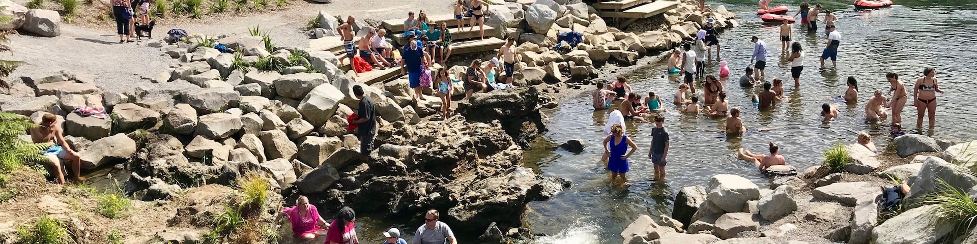 People gather at a hot spot in the Waikato river.  Because of the geothermal activity in this area, this area of the lake is like a hot tub. #waikatoriver #geothermal #nature #newzealand #taupo #hotspot