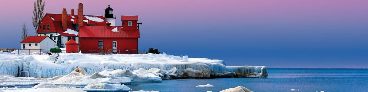 Traverse City showing general coastal views, a lighthouse and snow