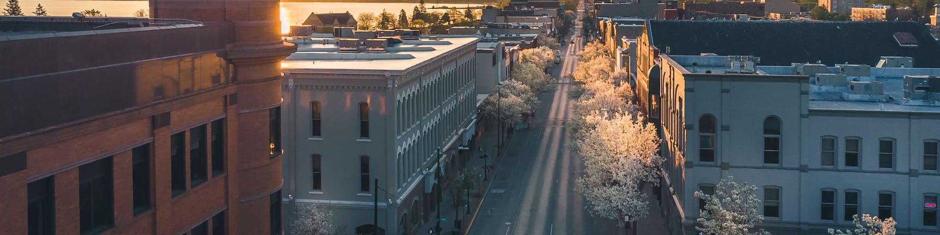Traverse City showing a sunset, a city and landscape views