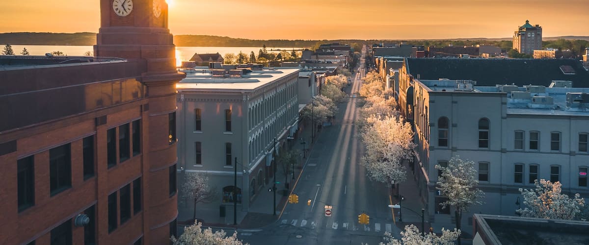 Traverse City showing a sunset, a city and landscape views