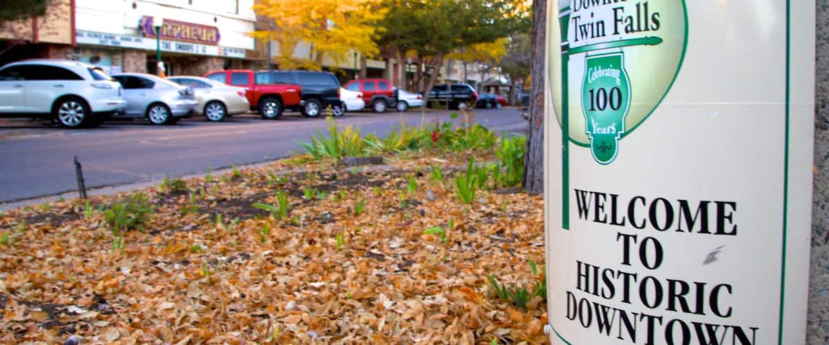 A sign for Historic Downtown Twin Falls with a 100-year celebration.