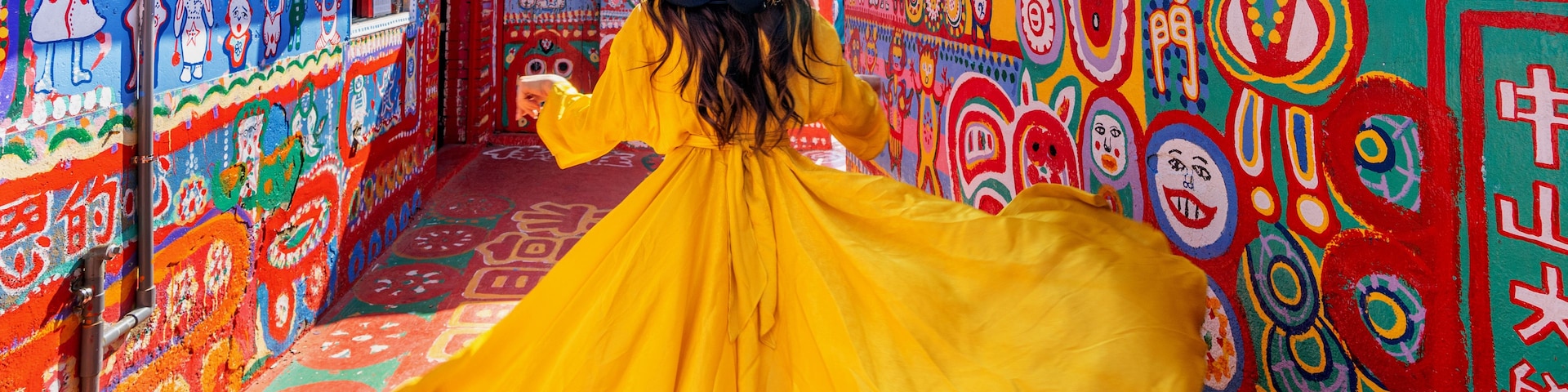 Woman standing at Rainbow village in Taichung, Taiwan.