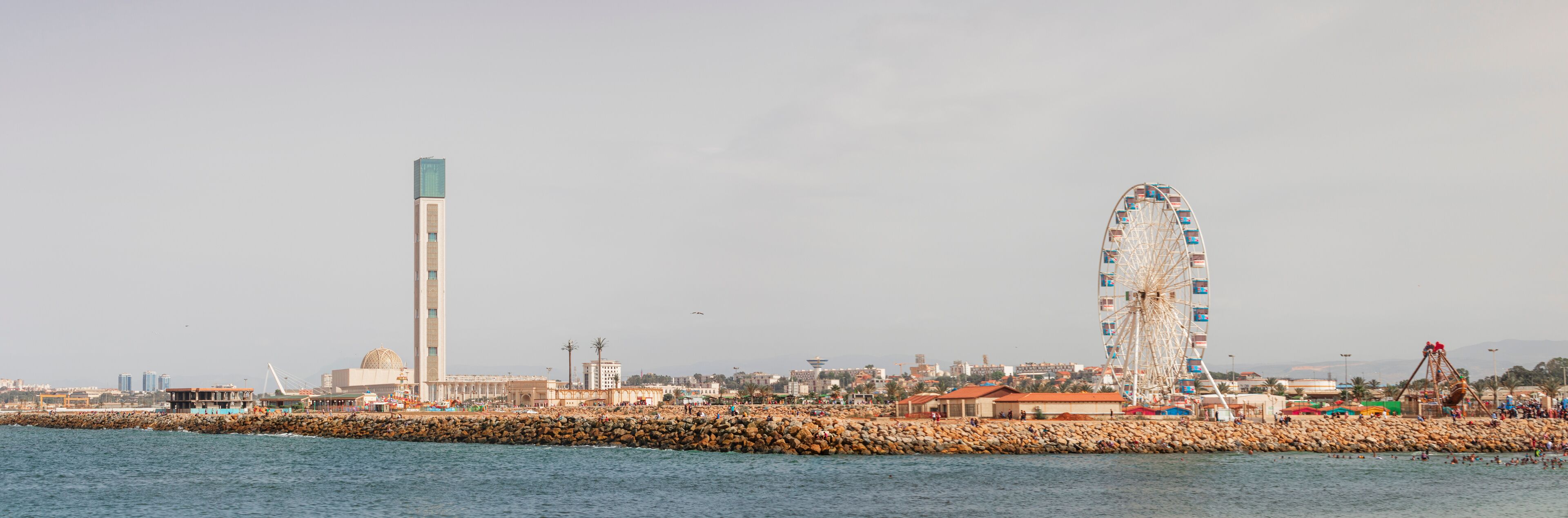 Algiers, panorama Cityscape for The Capital Of Algeria inculding Djamaa el Djazaïr also known as the Great Mosque of Algiers and sablette amusement park with the ferris wheel
