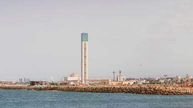 Algiers, panorama Cityscape for The Capital Of Algeria inculding Djamaa el Djazaïr also known as the Great Mosque of Algiers and sablette amusement park with the ferris wheel