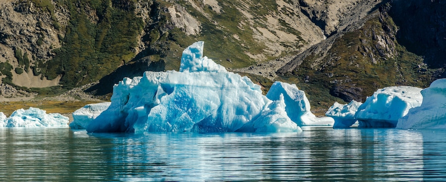 Small and blue iceberg near the coast