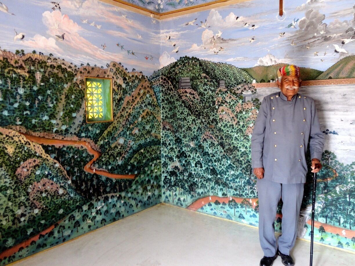 The Trident at Udaipur has an old hunting lodge of the kings on the premises. Its called the Bara Mahal and is accessible only to hotel guests. 

The gentleman in the picture has been the caretaker of the lodge for over 60 years - under the raja and now in the pay of the hotel. He opened up this exquisite room for us - all the walls are covered with beautiful Rajasthani miniature paintings picturing the area around Lake Pichola and  the local birds and animals. 