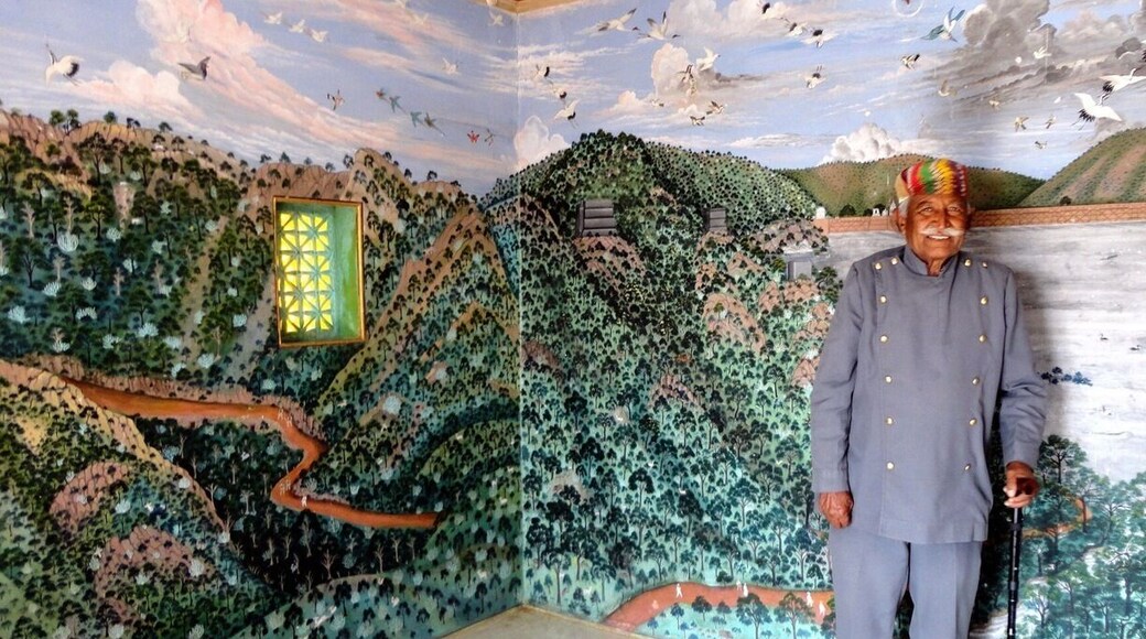 The Trident at Udaipur has an old hunting lodge of the kings on the premises. Its called the Bara Mahal and is accessible only to hotel guests.
The gentleman in the picture has been the caretaker of the lodge for over 60 years - under the raja and now in the pay of the hotel. He opened up this exquisite room for us - all the walls are covered with beautiful Rajasthani miniature paintings picturing the area around Lake Pichola and the local birds and animals.