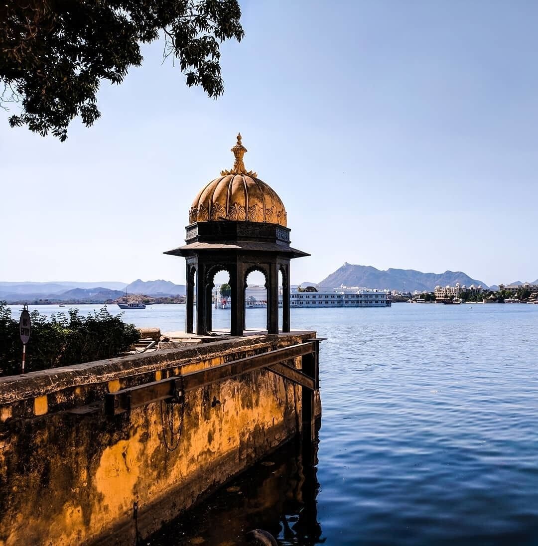 The view looking over Lake Pichola and The Taj Hotel from the banks of Udaipur's City Palace. #lifeatexpedia #merch 