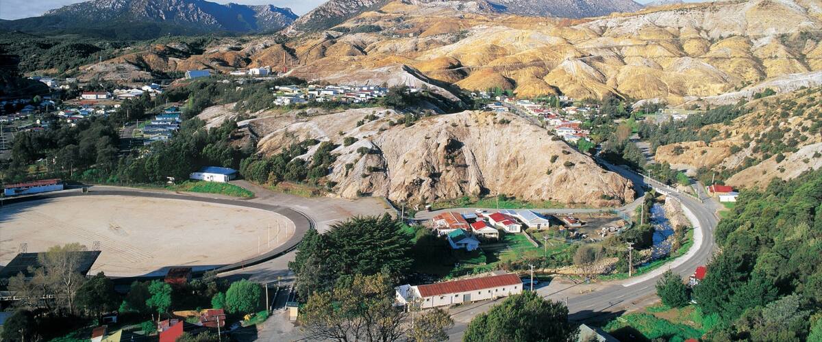 A mountainous landscape with a town nestled among the hills.