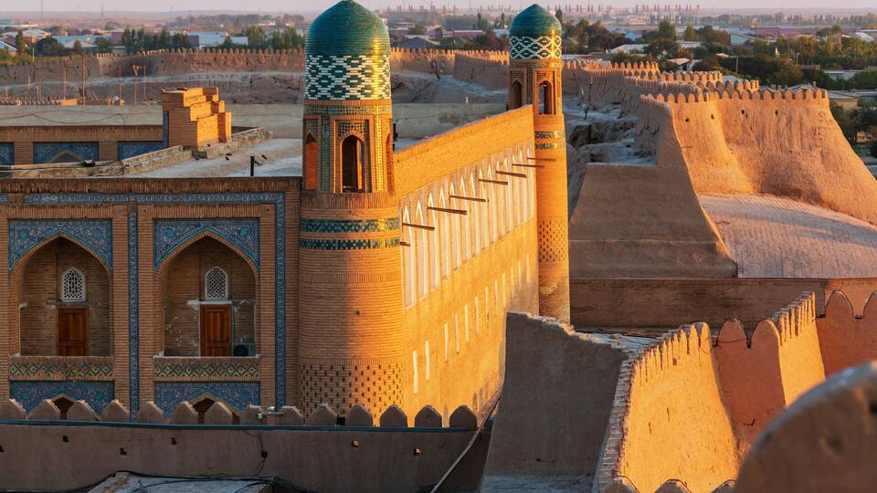 A historic fortress with ornate towers and a fortified wall.