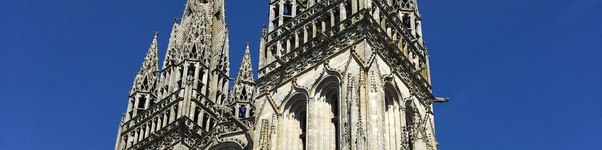 A large Gothic cathedral with intricate stone carvings and pointed spires.