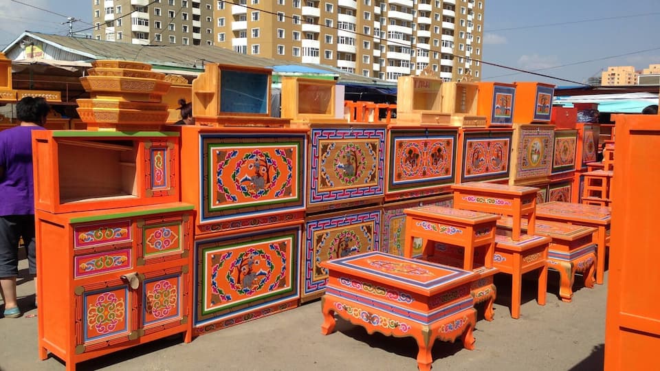 Ger furniture at the Narantuul market. The furniture is light for easy lifting when the gers are seasonally moved. This bright orange is definitely the traditional colour. I wonder why? #markets #colorful
