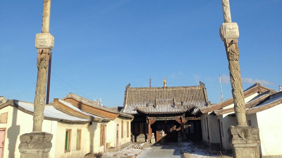 I haven't seen columns like these outside other Buddhist temples around Ulaanbaatar. Mostly you'll find a wall to the south to keep out the bad spirits. There wasn't anyone to ask why they had the columns although I know this is a special area for the birthplace of the Mongolian hero, Sukhbaatar.
