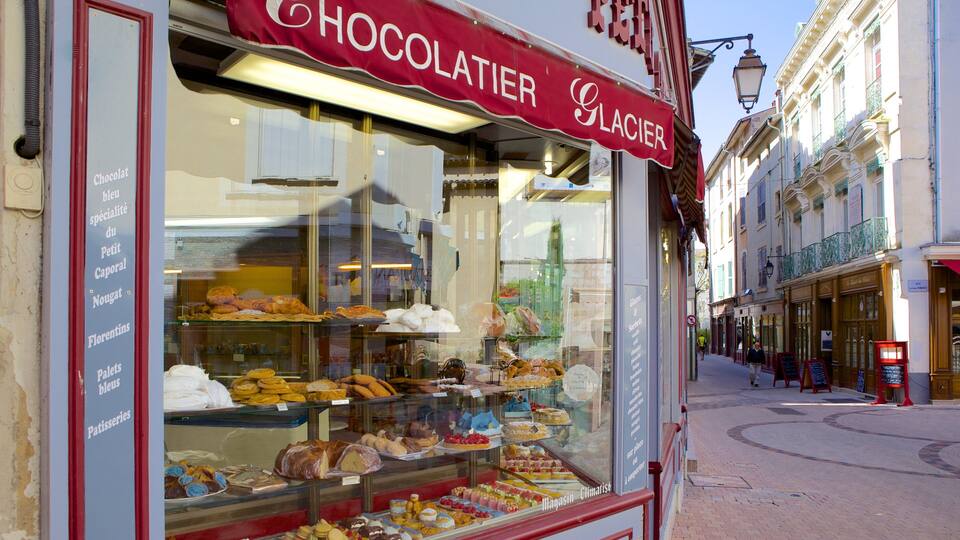 A chocolate shop with a variety of pastries and desserts on display.