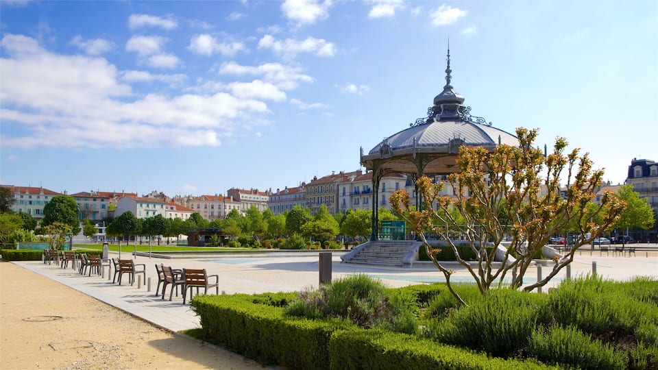 Valence showing a garden and a square or plaza