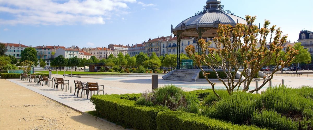 Valence showing a garden and a square or plaza