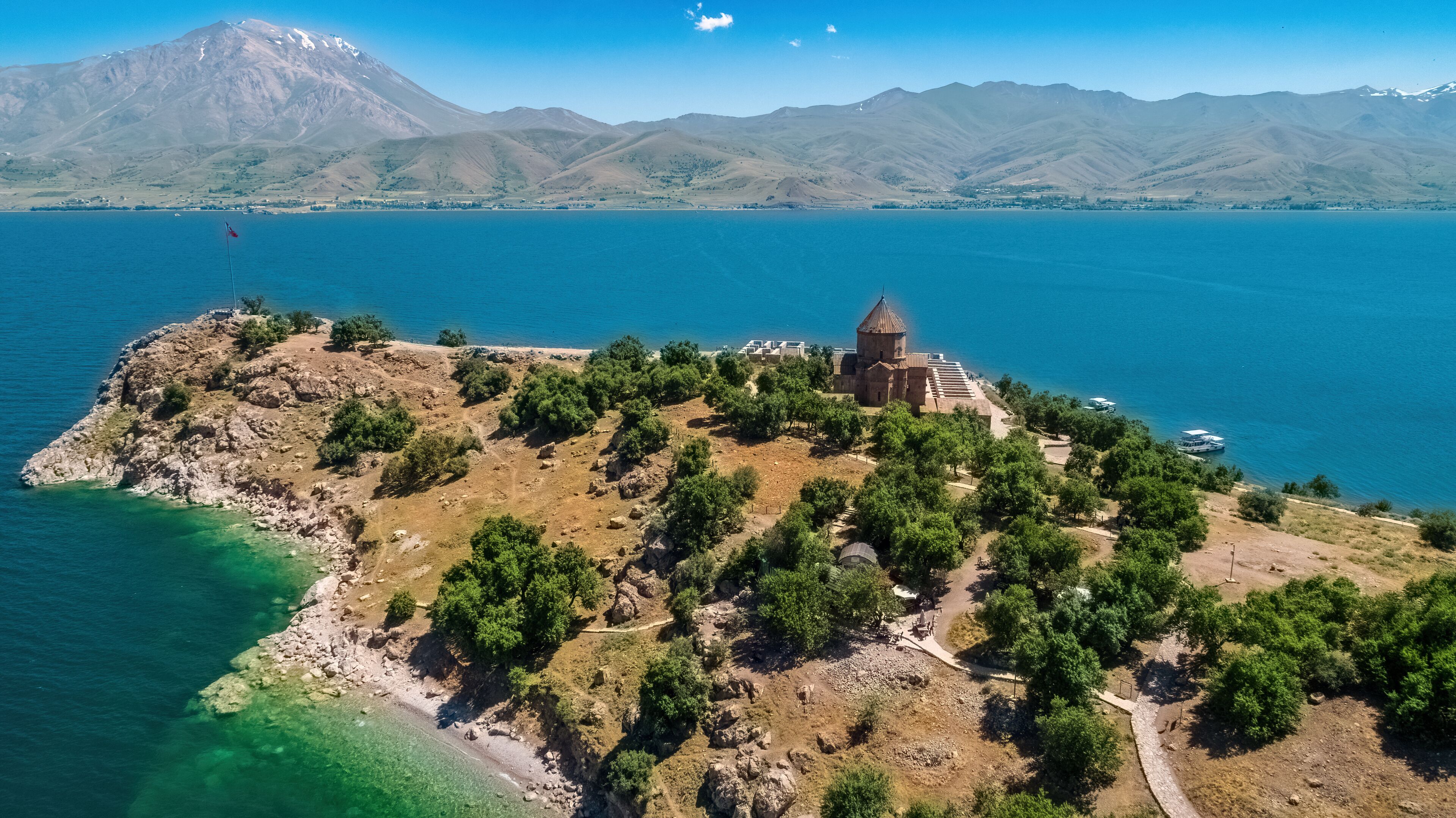 Akdamar Island and the view of the church on Mount Suphan. Aerial view of the church on the island with a drone. Van, Turkey.