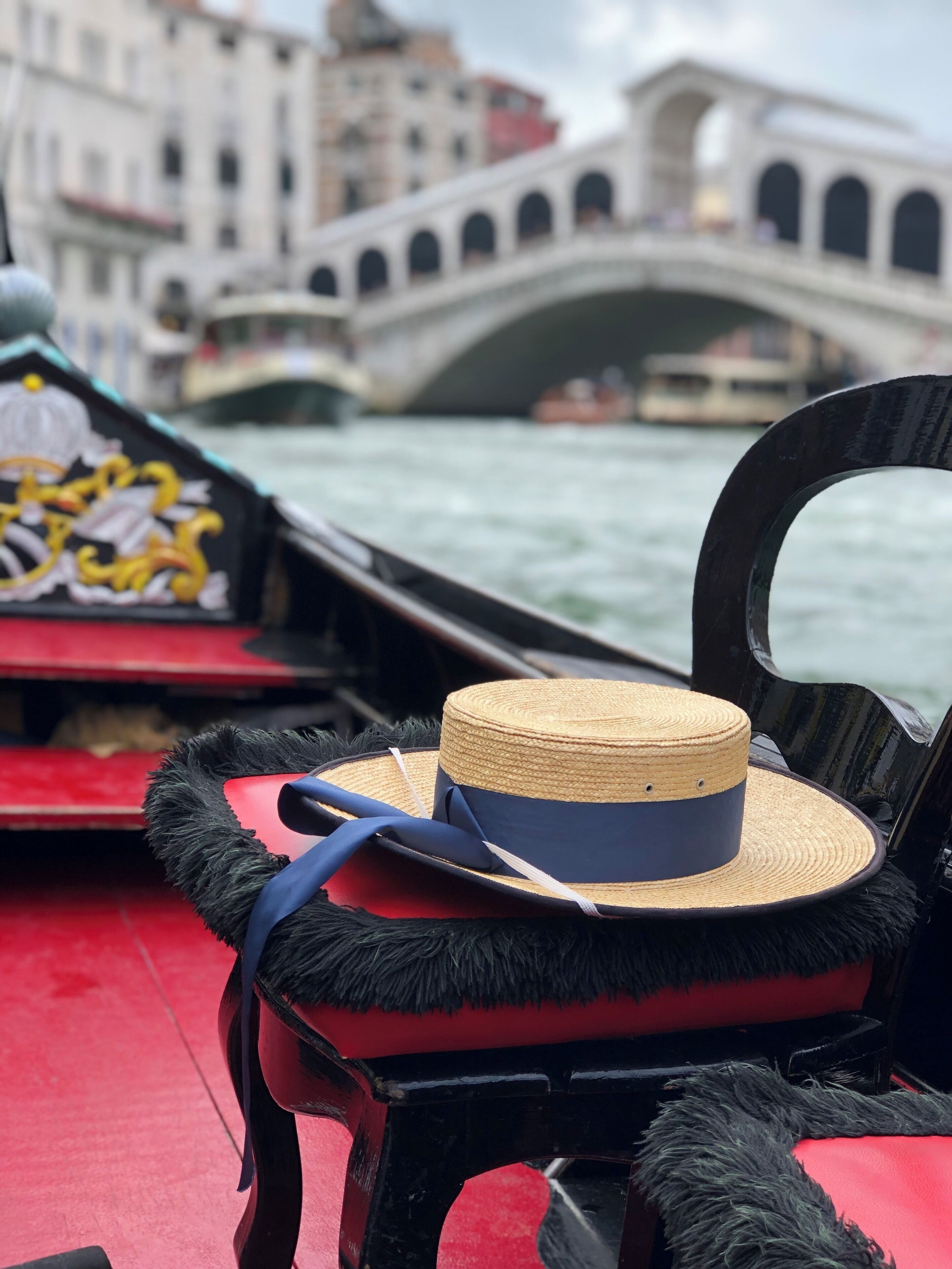 A classic gondola ride by the Rialto bridge! 80€ a boat is standard but you can have up to 6 people in most boats! #adventure #italy #venice #venezia #gondola #italia