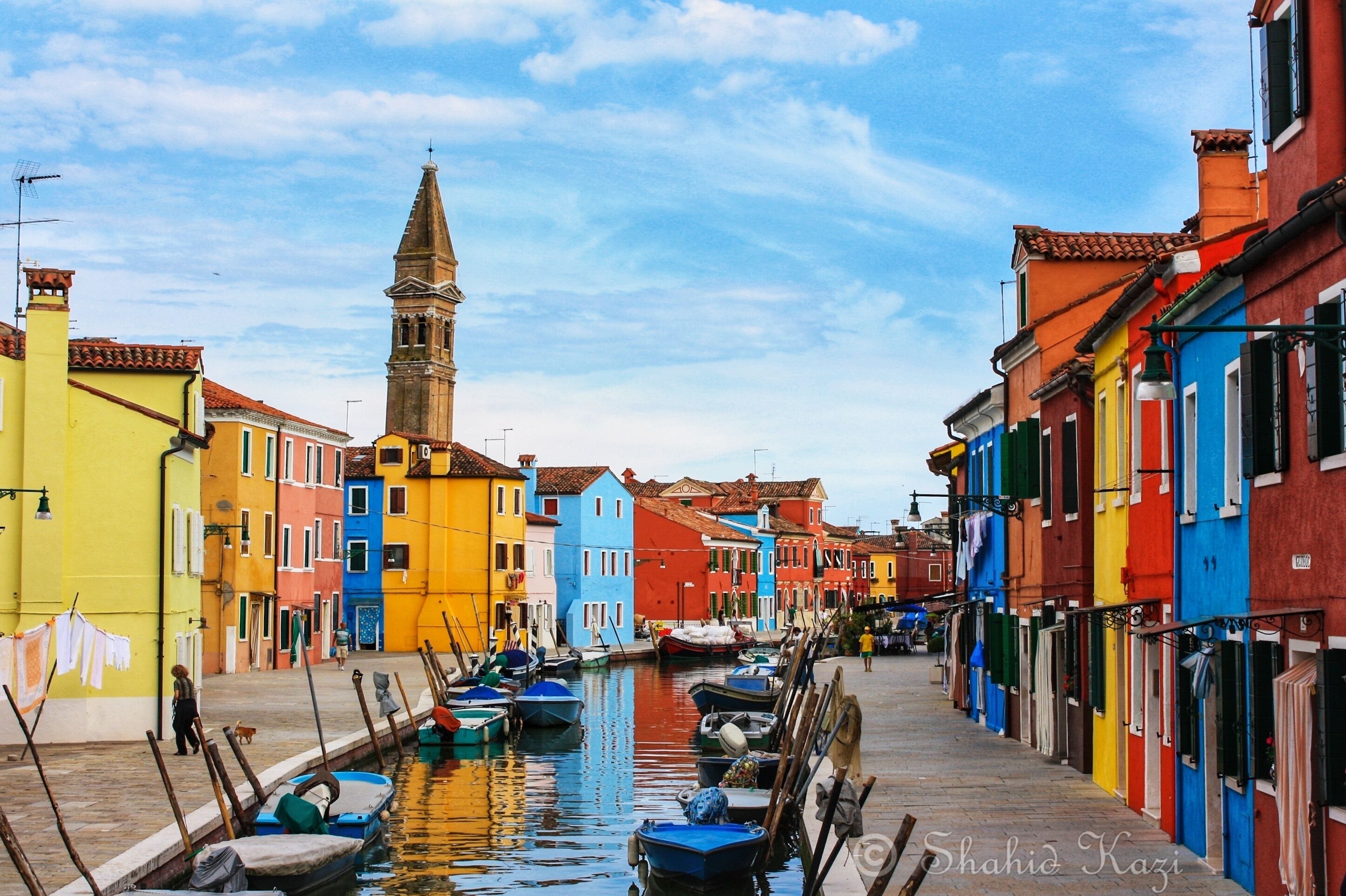 A little off the coast of Venice, lies the island of Burano, known for the brightly colored fishermen&#x27;s houses. Story goes that when the men went out long durations for fishing trips, the women painted and decorated their homes in free time to stay busy. The result is a picturesque town in the middle of the sea.

#photooftheday #photography #traveldiaries #burano #venice #italy #shahidscorner
