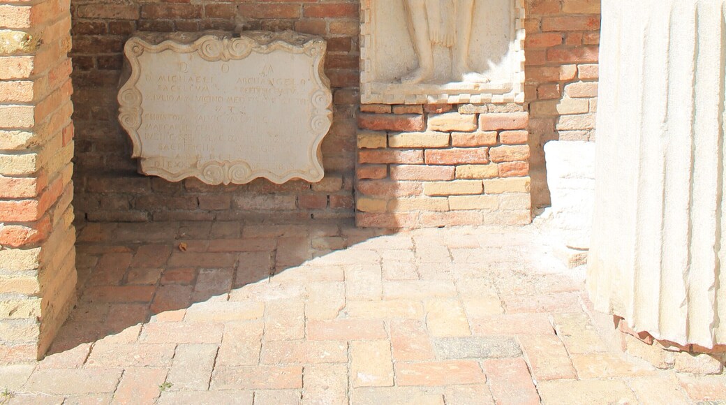 A cute little sunny island, covered in flowers and interesting little things to see like this wall!