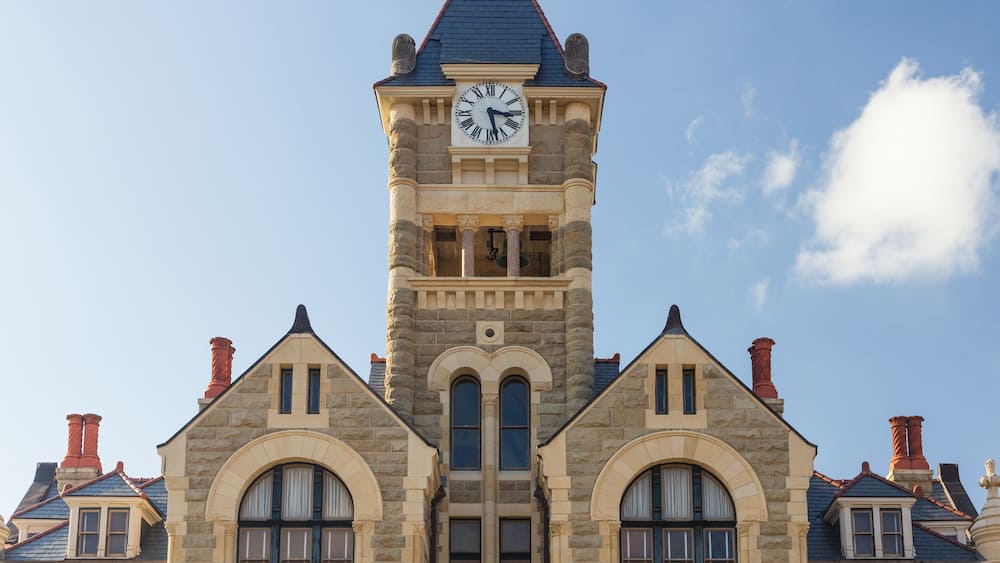 Built in 1892 of Texas. limstone, the Victoria County Courthouse is a Romanesque Revival style designed by J. Riely Gordon