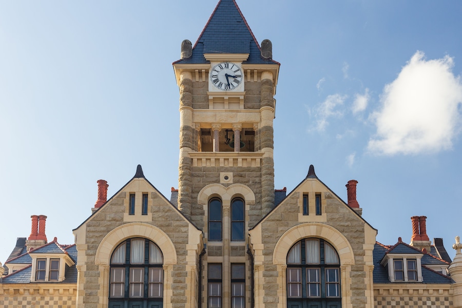 Built in 1892 of Texas. limstone, the Victoria County Courthouse is a Romanesque Revival style designed by J. Riely Gordon