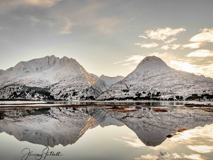 Winter reflecting the Chugatch Mountains onto Prince William Sound. The Old Town Valdez site is a great place to spot bears, and other wildlife during warmer months!