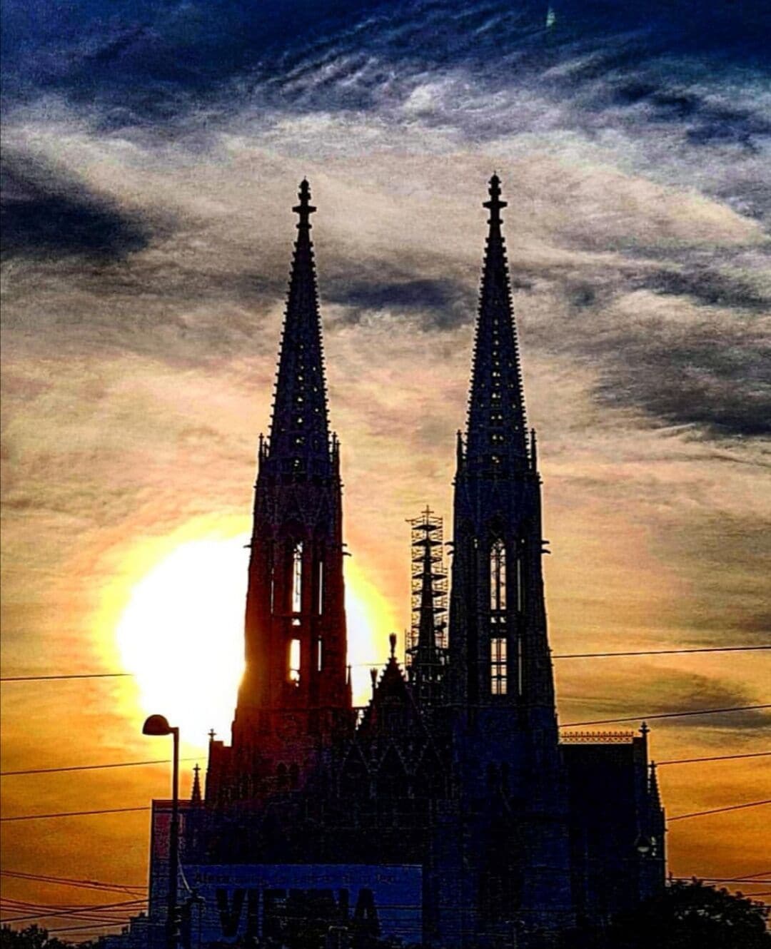 Beautiful sunset behind the gothic splendour of Vienna's Votivkirche