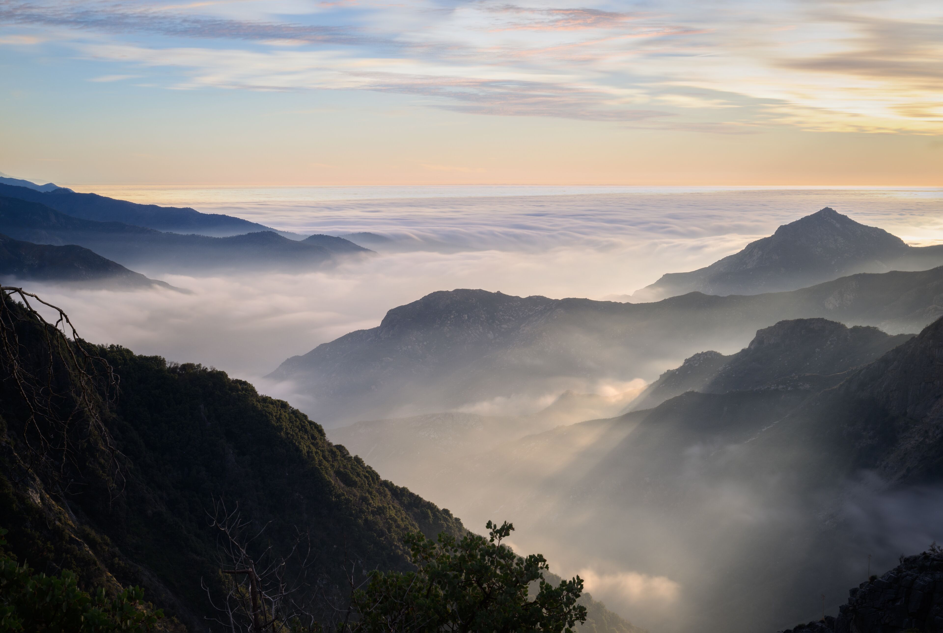 Clouds rolling among the mountains at sunset. Sequoia National Park. California. USA.