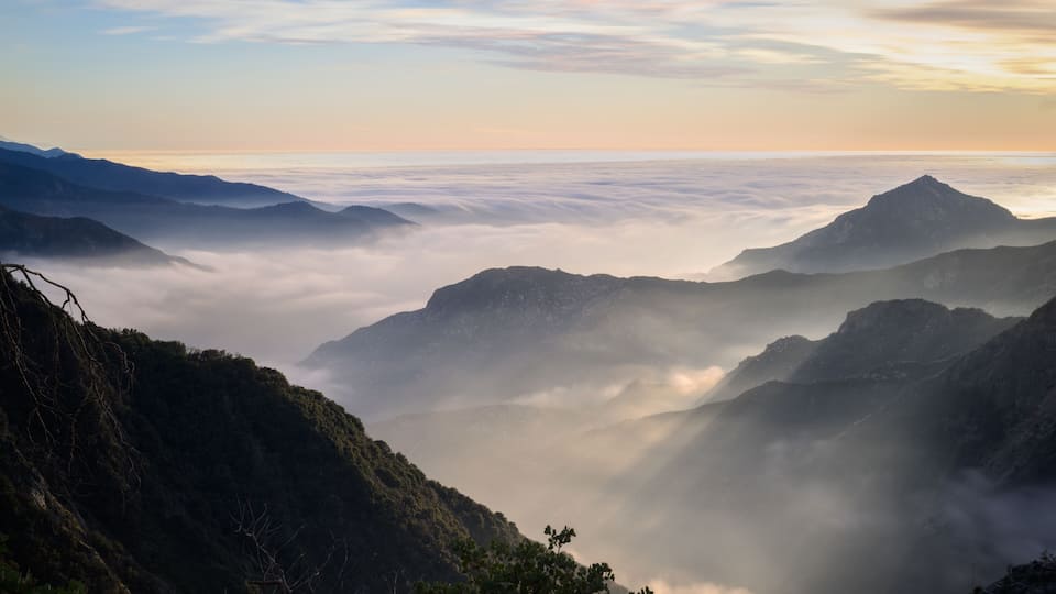 Clouds rolling among the mountains at sunset. Sequoia National Park. California. USA.