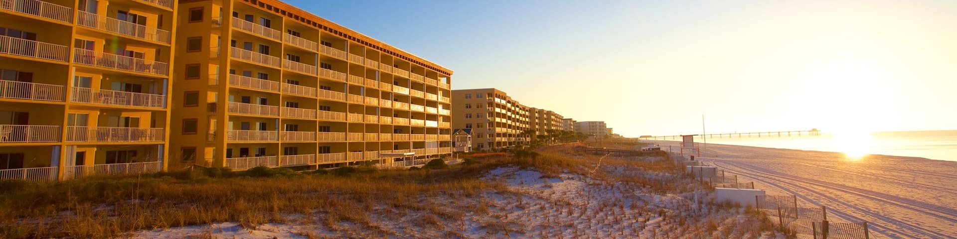 Fort Walton Beach showing a sandy beach, a sunset and a hotel